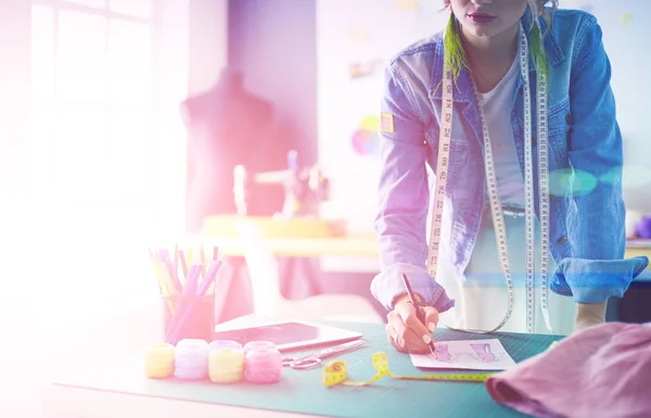 Fashion designer woman working on her designs in the studio — Stock Photo, Image