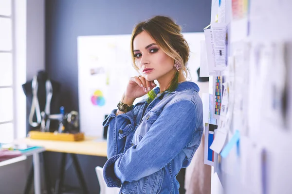 Fashion designer woman working on her designs in the studio — Stock Photo, Image