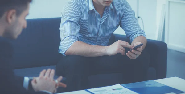 Business people sitting and discussing at meeting, in office — Stock Photo, Image