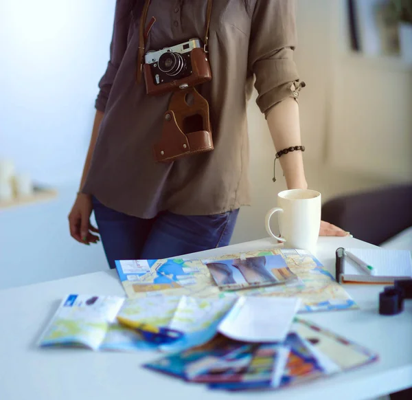 Female photographer sitting on the desk with laptop — Stock Photo, Image