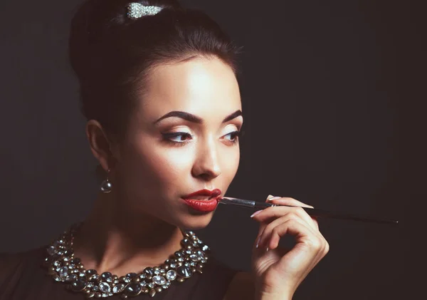 Portrait of young beautiful woman with jewelry — Stock Photo, Image