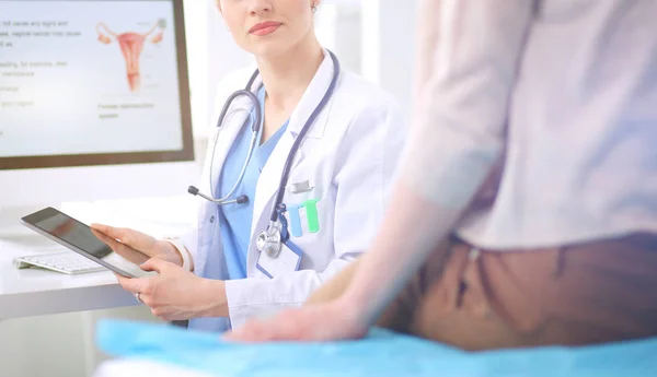 Doctor and patient discussing something while sitting at the table . Medicine and health care concept. Doctor and patient — Stock Photo, Image