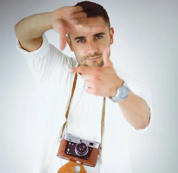 Young man with camera. Isolated over white background — Stock Photo, Image