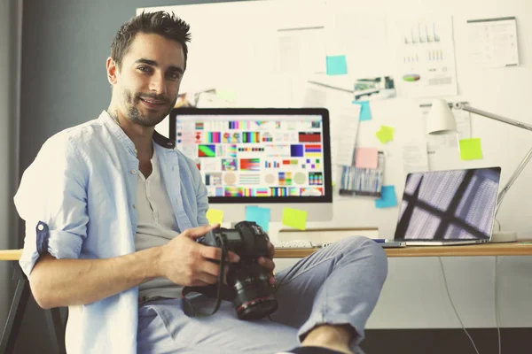 Portrait of young designer sitting at graphic studio in front of laptop and computer while working online. — Stock Photo, Image