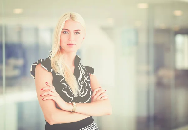 Stock image A beautiful blond business woman open the office door .