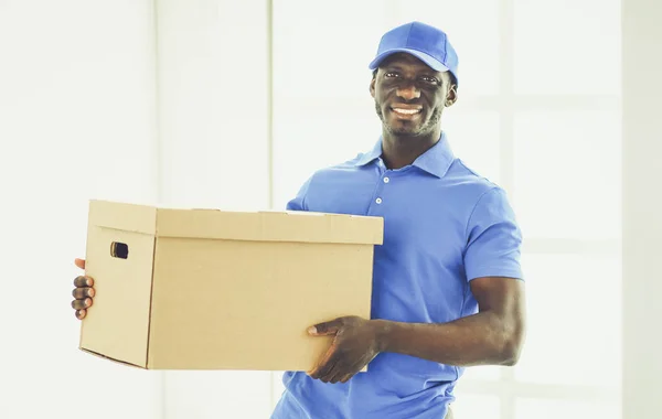 Portrait of an handsome happy deliverer with box — Stock Photo, Image
