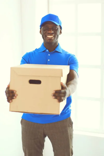 Portrait of an handsome happy deliverer with box — Stock Photo, Image