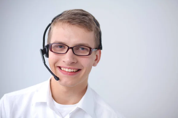 Portrait of young man smiling sitting on gray background. Portrait of young man — Stock Photo, Image