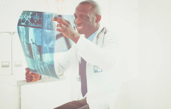 Portrait young african medical doctor holding patients x-ray — Stock Photo, Image