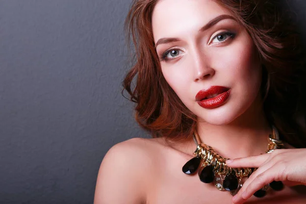 Beautiful woman with evening make-up in black dress — Stock Photo, Image