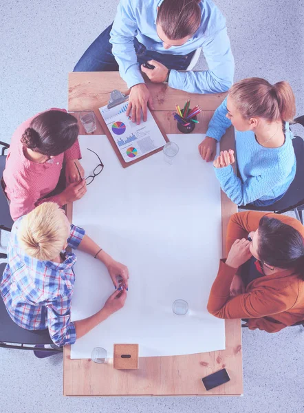 Business people sitting and discussing at meeting, in office — Stock Photo, Image