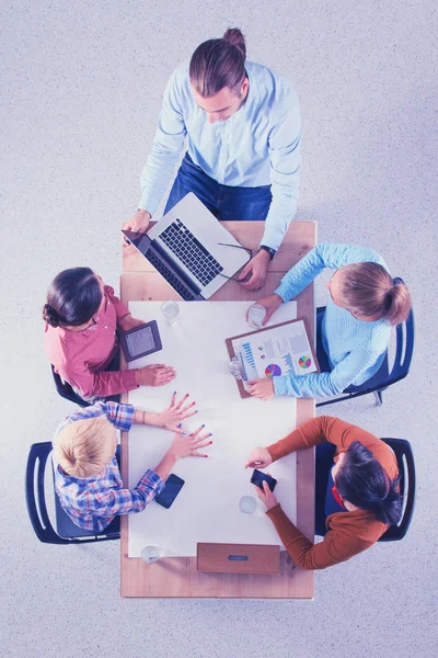 Business people sitting and discussing at meeting, in office — Stock Photo, Image