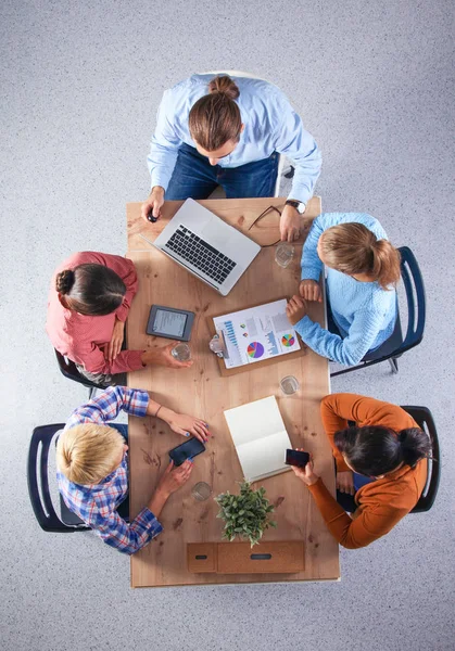 Business people sitting and discussing at meeting, in office — Stock Photo, Image