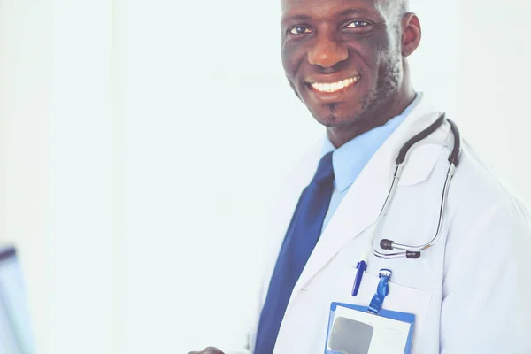 Male black doctor worker with tablet computer standing in hospital — Stock Photo, Image