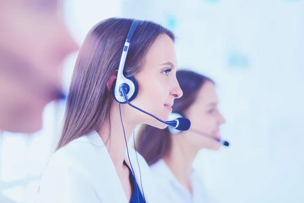 Smiling businesswoman or helpline operator with headset and comp — Stock Photo, Image