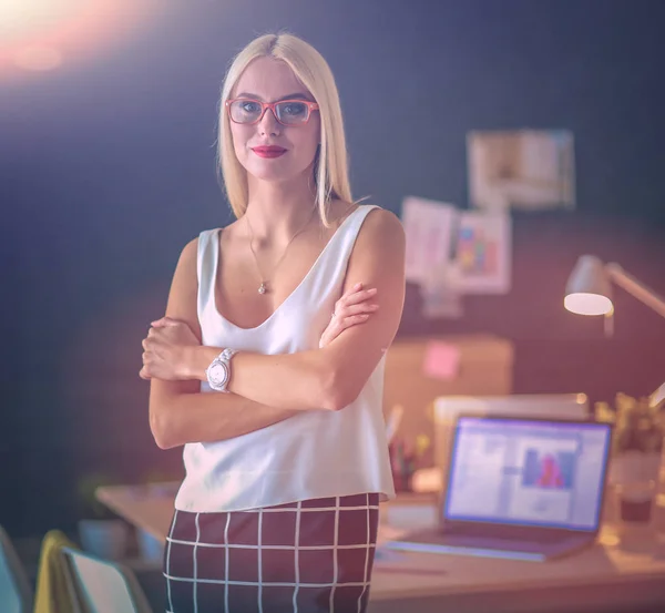 Portrait of an executive professional mature businesswoman sitting on office