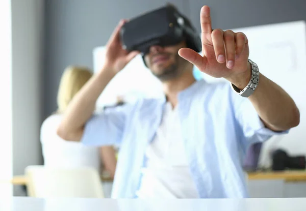 Young male software programmer testing a new app with 3d virtual reality glasses in office. — Stock Photo, Image