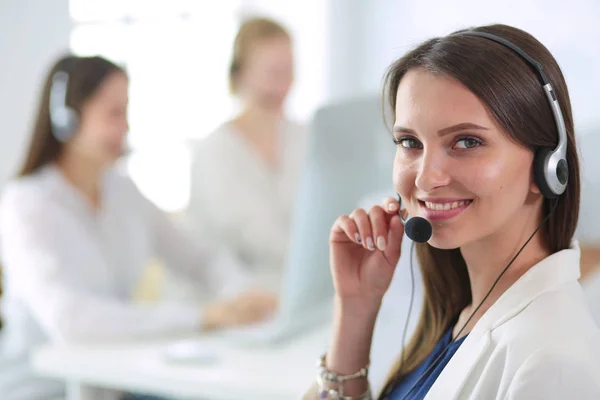 Attractive business woman working on laptop at office. Business people