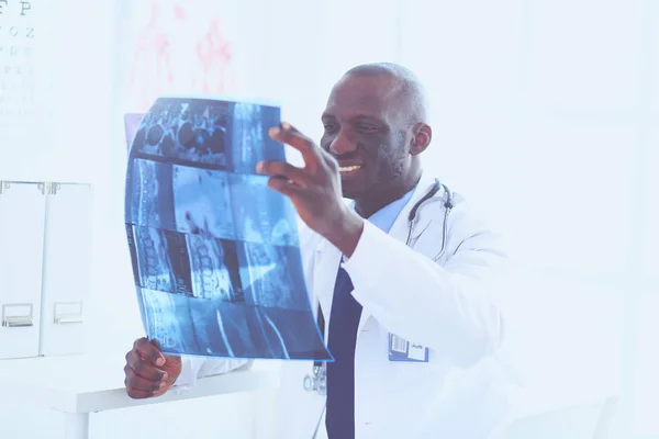 Portrait young african medical doctor holding patients x-ray — Stock Photo, Image