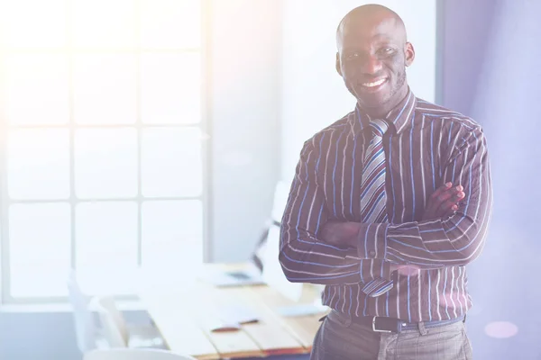 Portrait of an handsome black businessman standing in office — Stock Photo, Image