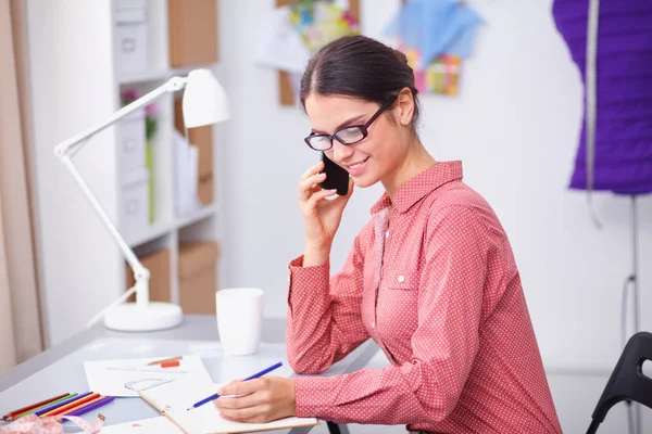 Modern young fashion designer working at studio — Stock Photo, Image