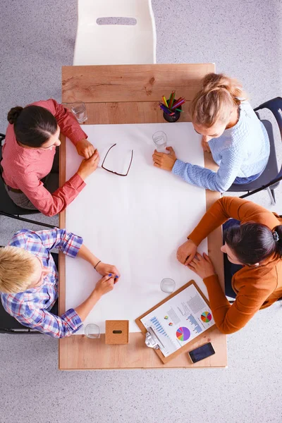 Business people sitting and discussing at meeting, in office — Stock Photo, Image