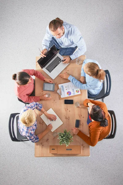 Business people sitting and discussing at meeting, in office — Stock Photo, Image