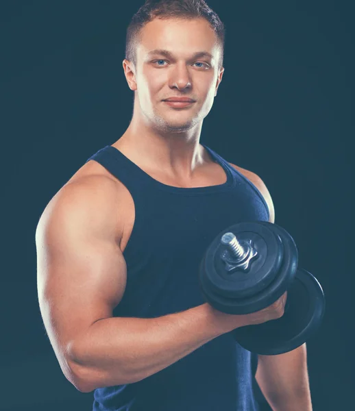 Handsome muscular man working out with dumbbells — Stock Photo, Image