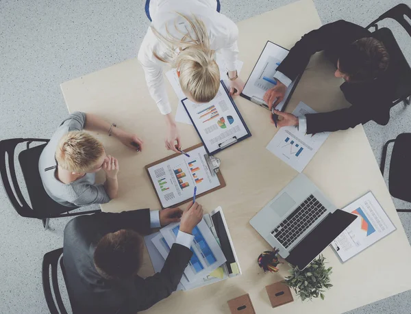 Business people sitting and discussing at meeting, in office. — Stock Photo, Image