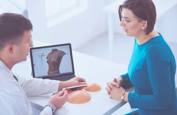 Doctor showing young patient her chest xray in his office at the hospital — Stock Photo, Image