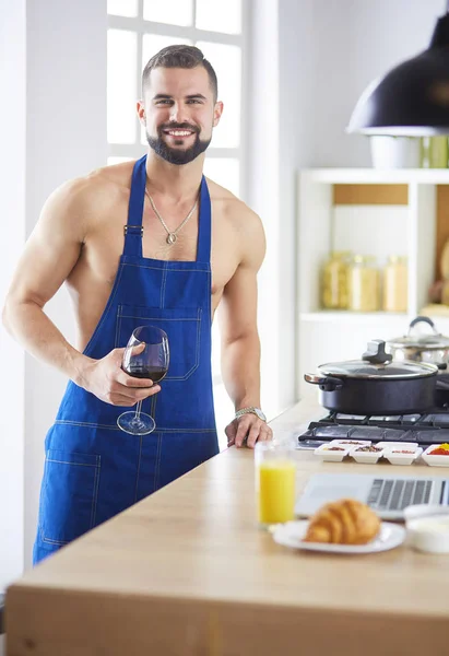 Man preparing delicious and healthy food in the home kitchen