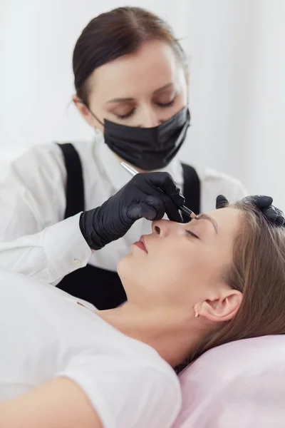 Microblading eyebrows work flow in a beauty salon.
