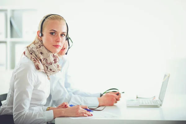 Attractive positive young businesspeople and colleagues in a call center office. Businesspeople — Stock Photo, Image