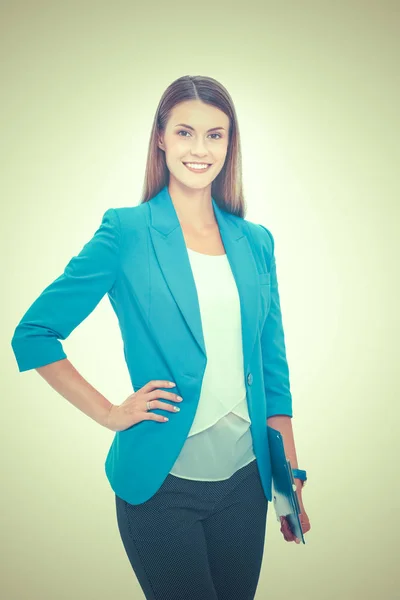 Portrait of a confident young woman standing isolated on white background — Stock Photo, Image