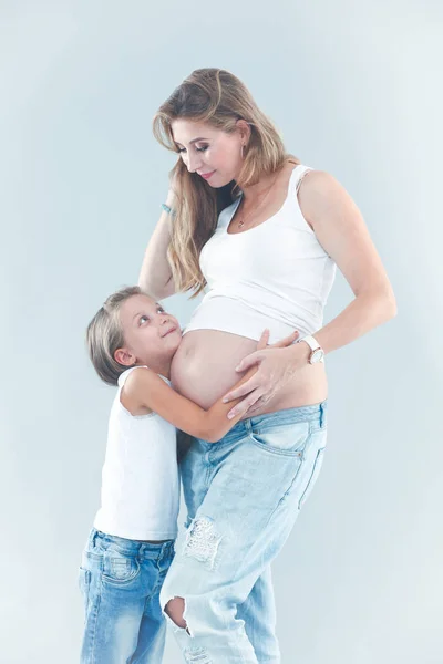 Pregmnant women and happy girl. — Stock Photo, Image