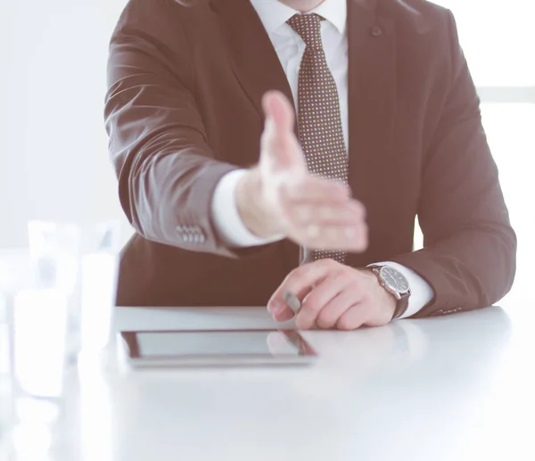 Portrait of businessman giving hand for handshake.