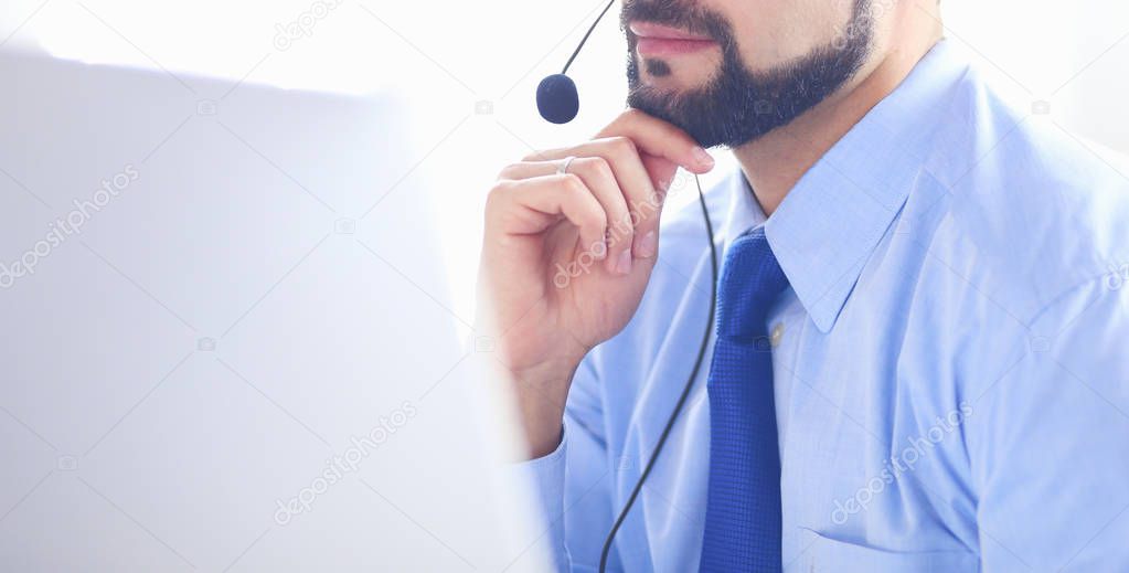 Businessman in the office on the phone with headset, Skype, FaceTime