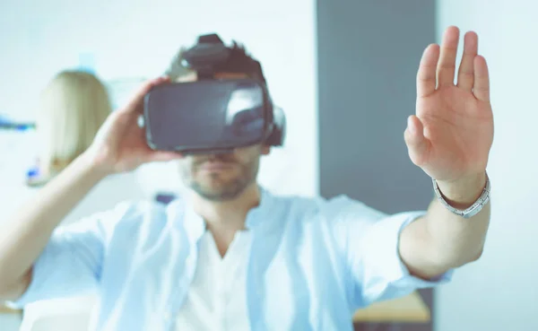 Young male software programmer testing a new app with 3d virtual reality glasses in office. — Stock Photo, Image