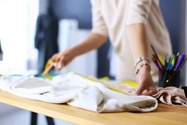 Fashion designer woman working on her designs in the studio. — Stock Photo, Image
