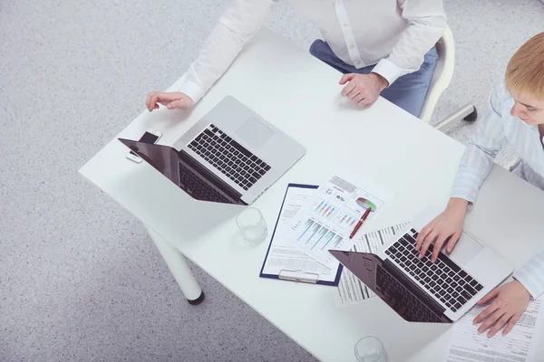 Business people working together at desk, white background — Stock Photo, Image