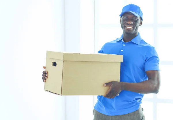 Portrait of an handsome happy deliverer with box — Stock Photo, Image