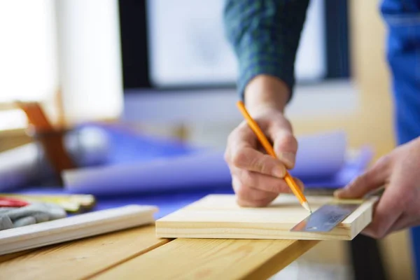 Architect working on drawing table in office — Stock Photo, Image