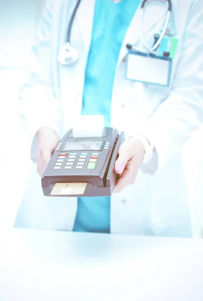 Doctor is holding payment terminal in hands. Paying for health care. Doctor — Stock Photo, Image