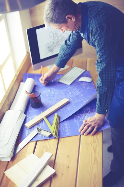 Architect working on drawing table in office — Stock Photo, Image