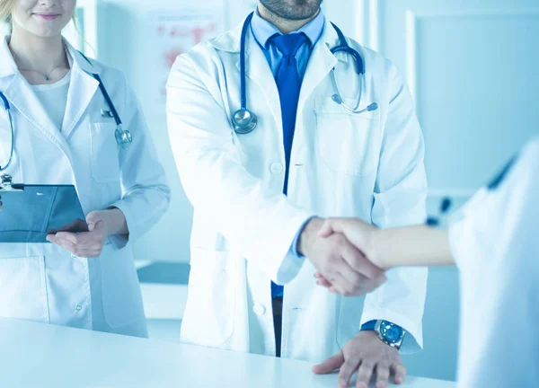 Young medical doctor people handshaking at office