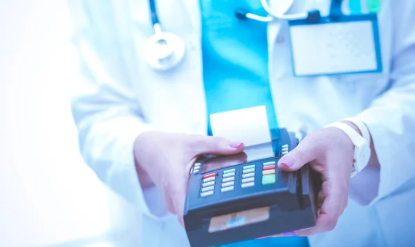 Doctor is holding payment terminal in hands. Paying for health care. Doctor — Stock Photo, Image