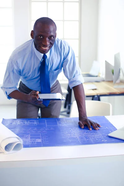Portrait of an handsome black businessman standing in office — Stock Photo, Image