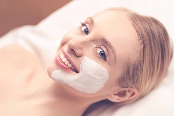 Spa facial mask application. Spa beauty organic facial mask application at day spa salon.