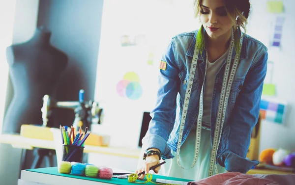 Fashion designer woman working on her designs in the studio — Stock Photo, Image