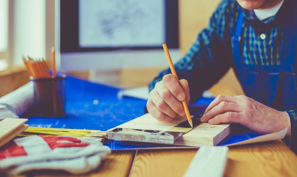 Architect working on drawing table in office — Stock Photo, Image